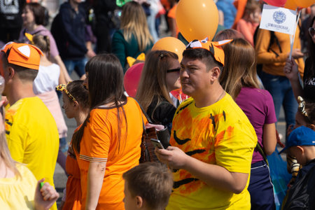 Vladivostok, Primorsky Krai-September 29, 2019: City square with people and cars during Tiger Day celebrations. The carnival is dedicated to the protection of ecology and the far Eastern tigers.のeditorial素材