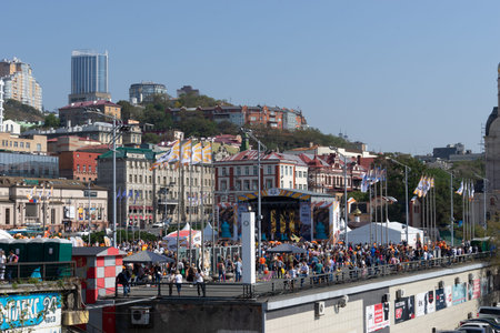 Vladivostok, Primorsky Krai-September 29, 2019: City square with people and cars during Tiger Day celebrations. The carnival is dedicated to the protection of ecology and the far Eastern tigers.のeditorial素材