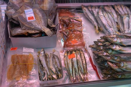 Petropavlovsk-Kamchatsky, Russia-October 6, 2019: Dried and smoked fish in the seafood market showcase.のeditorial素材