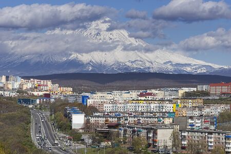 Petropavlovsk-Kamchatsky. Urban landscape with buildings and streets on the background of the volcano.の写真素材