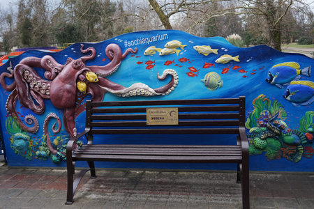 Sochi, Russia-January 25, 2017: Park Bench at the Aquarium wall.のeditorial素材