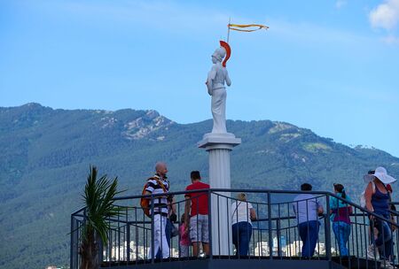 Yalta, Crimea-June 12, 2014: People on the waterfront of the city on the background ofのeditorial素材