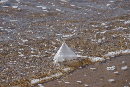 Natural background with a plastic bag on the background of water.の写真素材