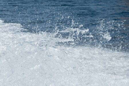 Water background with white splashes.の写真素材