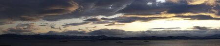 Panorama of the sea landscape under the evening sky, Kamchatkaの写真素材
