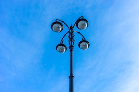 Beautiful street lamp on blue sky background. Vladivostok, Russiaの写真素材