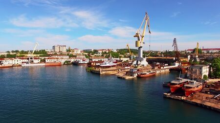 Aerial view of the coastline of Sevastopol with ships and cranesの写真素材
