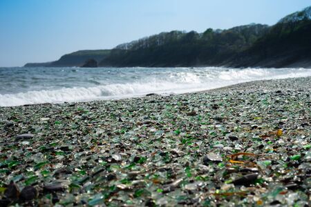 Seascape with a rock in the waves. Glass beach in Vladivostok.の写真素材