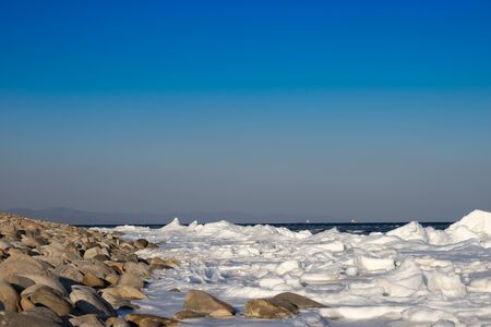 Marine landscape with views of the icy shore in winterの写真素材