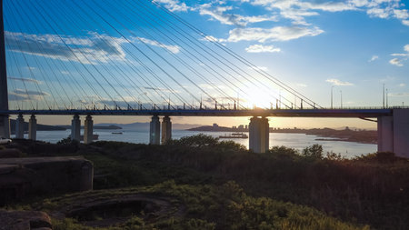 Natural landscape with views of the Russian bridge and sunset. Vladivostok, Russia.