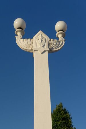 Sochi, Krasnodar region. Beautiful white stone lamppost on background of blue sky.の写真素材