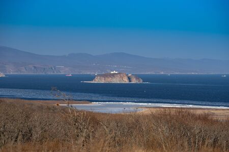 Island on the background of the seascape. Vladivostok, Russia.の写真素材