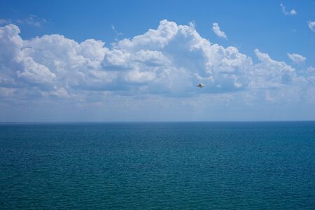Seascape with water surface and sky with clouds.の写真素材