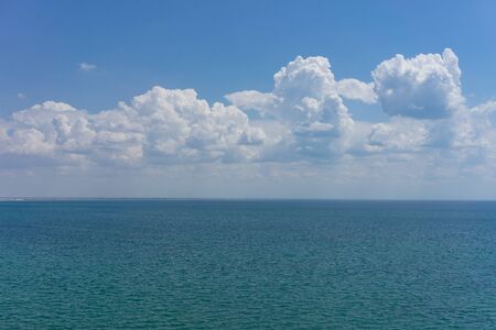 Seascape with water surface and sky with clouds.の写真素材
