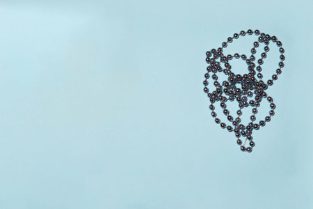 Christmas beads for Christmas tree on blue background.の写真素材