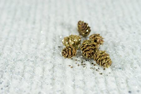 Gold-plated cones with sequins on a light backgroundの写真素材