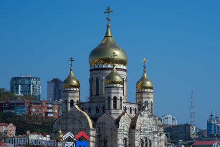 Vladivostok, Primorsky Krai-September 29, 2019: Cityscape with a view of the building of the temple...