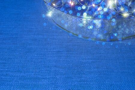 Blue Christmas background with holiday design details on woven surfaceの写真素材