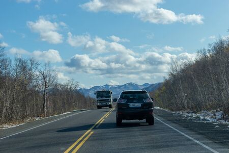 Petropavlovsk-Kamchatsky, Russia-October 7, 2019: Country landscape with busy road and carsのeditorial素材