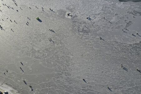 Aerial view of the Bay in the ice with fishermen on winter fishing. Vladivostok, Russiaの写真素材