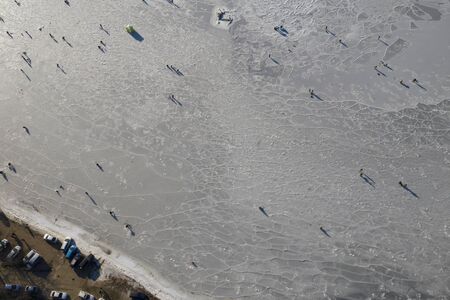 Aerial view of the Bay in the ice with fishermen on winter fishing. Vladivostok, Russiaの写真素材