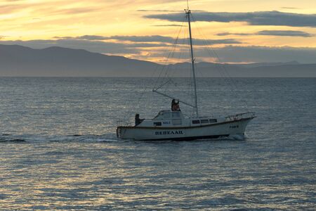 Vladivostok, Russia-August 26, 2018: Boat with people on the background of the seascape and sunset.のeditorial素材
