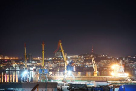 Vladivostok, Russia-November 4, 2019: Night landscape with port view on city background.のeditorial素材