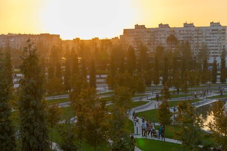Krasnodar, Russia-October 8, 2017: Modern Galitsky Park at sunset. People walk among the trees.のeditorial素材