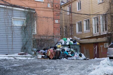 Vladivostok, Russia-January 23, 2020: Urban landscape with a large garbage pile in the yardのeditorial素材