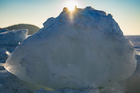 Ice blocks on the background of the frozen sea.