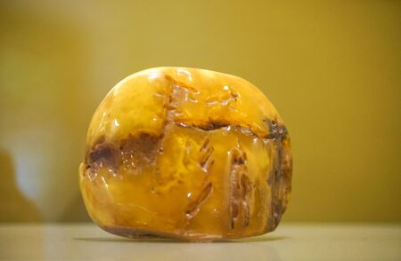 Kaliningrad, Russia-may 14, 2015: Amber Museum. Collection of objects of history and art. Large amber stone on a light surface.のeditorial素材