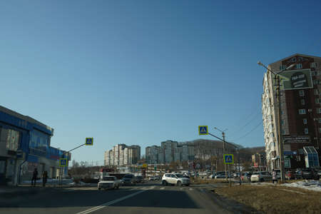 Nakhodka, Russia-January 10, 2020: Urban landscape with views of the road, buildings and people.のeditorial素材