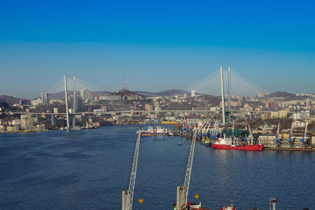 Vladivostok, Russia - April 12, 2020: Aerial overview of the Golden Horn Bay overlooking the seaport and ships.のeditorial素材