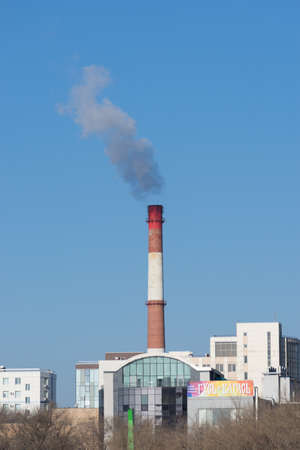 Vladivostok, Russia-December 1, 2018: Pipe of the city boiler house on the background of the urban landscapeのeditorial素材