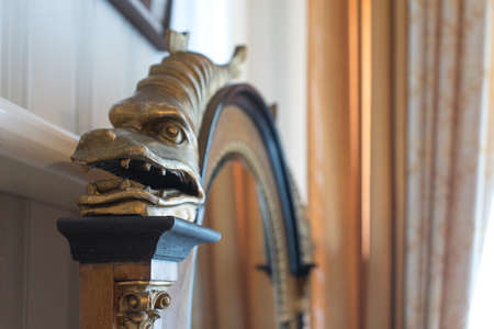 Yalta, Crimea-may 30, 2016: Interior details of the Livadia Palace. Wooden figure of a fish on the Royal furniture.のeditorial素材