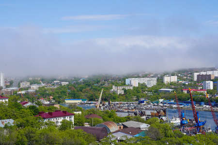 Vladivostok, Russia-may 25, 2020: Urban landscape with views of Diomede Bay and port.のeditorial素材