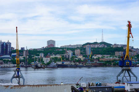 Vladivostok, Russia-June 6, 2020: Industrial landscape with a port and cranes in the Golden horn Bayのeditorial素材