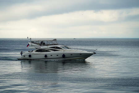 Vladivostok, Russia-July 6, 2020: White boat on the background of the seascape with people.のeditorial素材