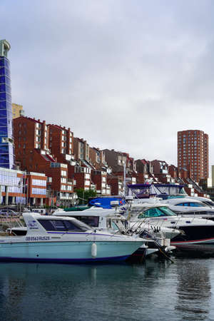 Vladivostok, Russia-July 6, 2020: Urban landscape with views of the yacht Park and housesのeditorial素材