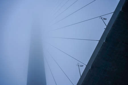 Construction of the Golden bridge in the fog. Vladivostok, Russiaの写真素材