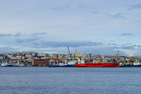 Murmansk, Russia-June 5, 2015: Ship in the Kola Bay on the background of the city.のeditorial素材
