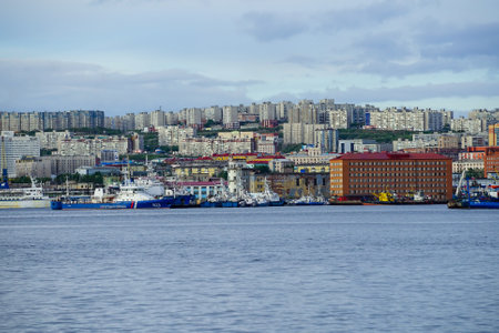 Murmansk, Russia-June 5, 2015: Ship in the Kola Bay on the background of the city.のeditorial素材