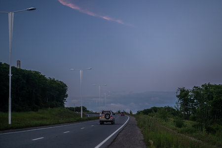Vladivostok, Russia-June 13, 2020: Evening landscape with a road on Russian island.のeditorial素材
