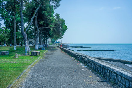 Ochamchira, Abkhazia-July 26, 2015: Urban landscape with a view of the embankment and the sea.のeditorial素材