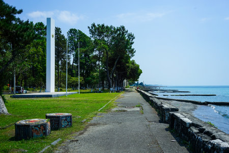Ochamchira, Abkhazia-July 26, 2015: Urban landscape with a view of the embankment and the sea.のeditorial素材