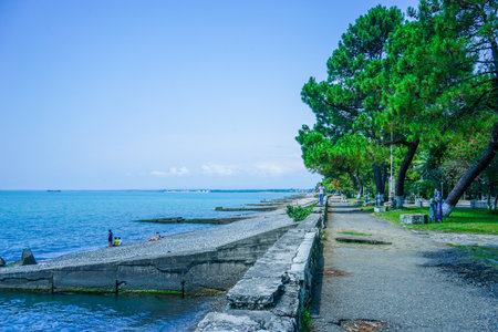 Ochamchira, Abkhazia-July 26, 2015: Urban landscape with a view of the embankment and the sea.のeditorial素材