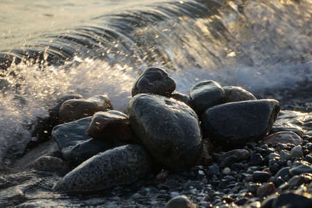 Natural background with large stones and waves.の写真素材
