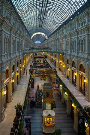 Moscow, Russia-June 2, 2015: Interior of the Gum building in the evening with people.のeditorial素材