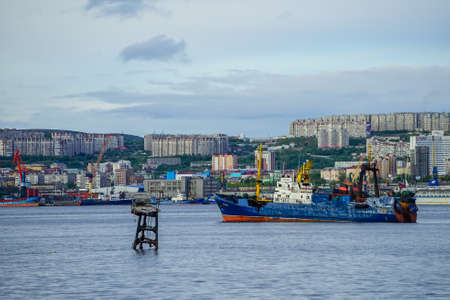 Murmansk, Russia-June 5, 2015: Ship in the Kola Bay on the background of the city.のeditorial素材