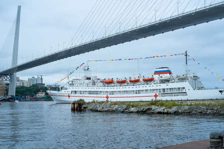 Vladivostok, Russia - July 26, 2020: Warships on the background of the urban landscape. Day of the Navy.のeditorial素材
